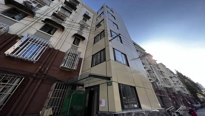 因为群众呼声,这些电梯外墙从砖头成为美形玻璃景观
