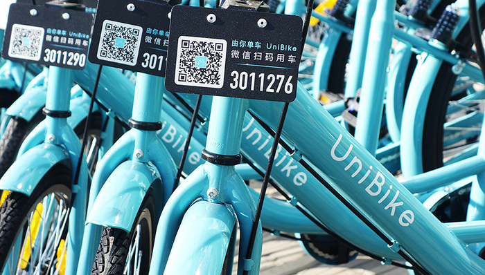 摩拜,ofo,单车,腾讯,收购,知情人士,一线城市,高端市场,对标,规避法律