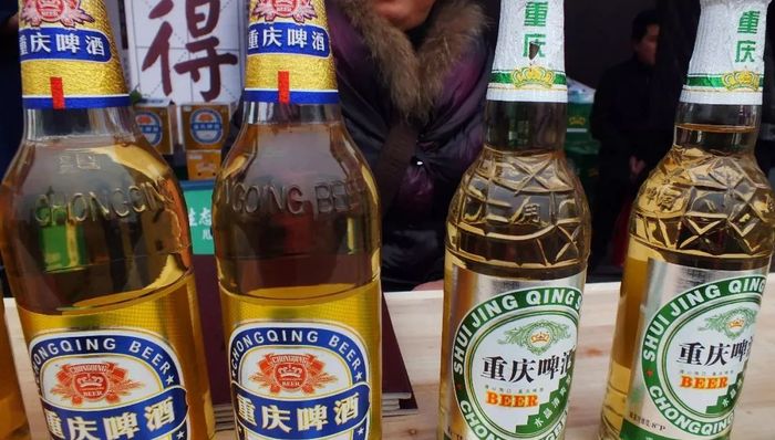 重庆啤酒,嘉士伯