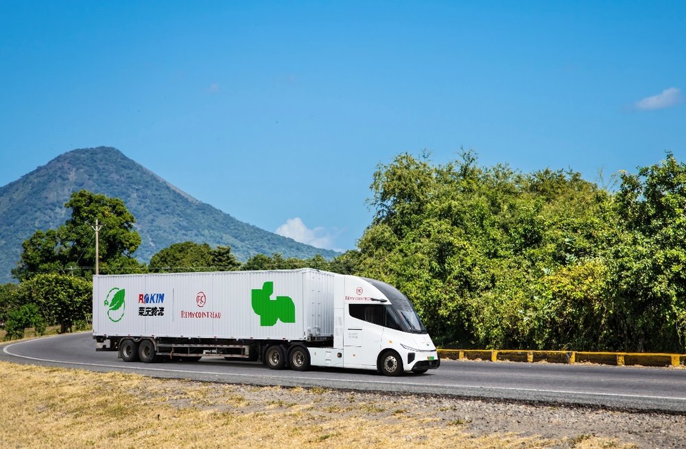 A white truck on the roadDescription automatically generated