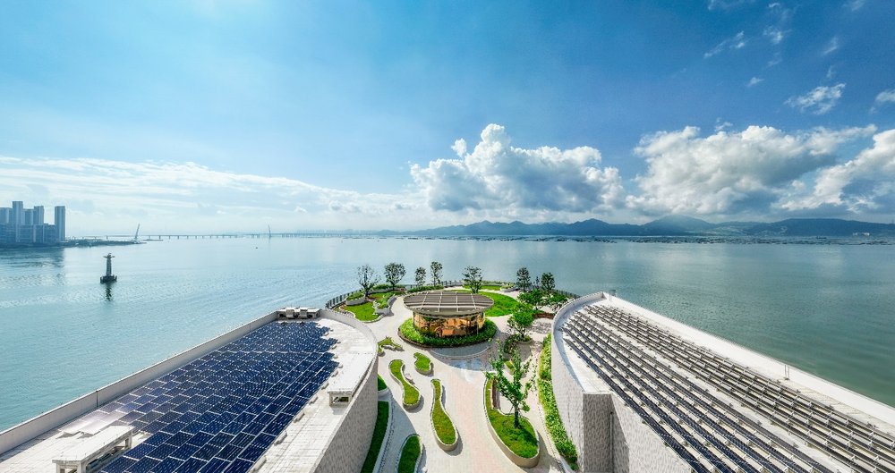 A large building with a large pool and a large building with a large building and a large building with a large building and a large building with a large building and a large building with a large buildingDescription automatically generated with medium confidence