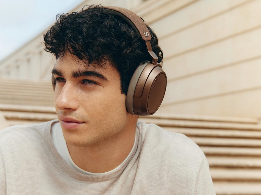 A person wearing headphonesAI-generated content may be incorrect.