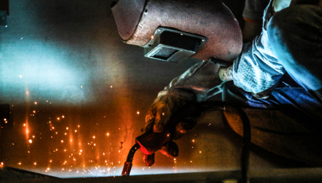 China manufacturing expands in August, input prices climb