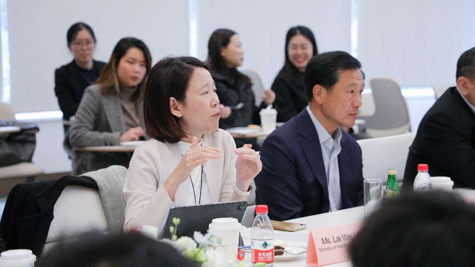 A group of people sitting at tablesAI-generated content may be incorrect.