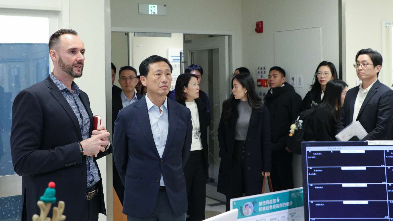 A group of people standing in a hallwayAI-generated content may be incorrect.